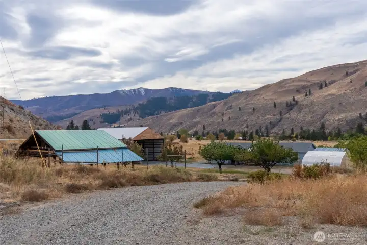 View of the property, looking down the driveway from the highway.