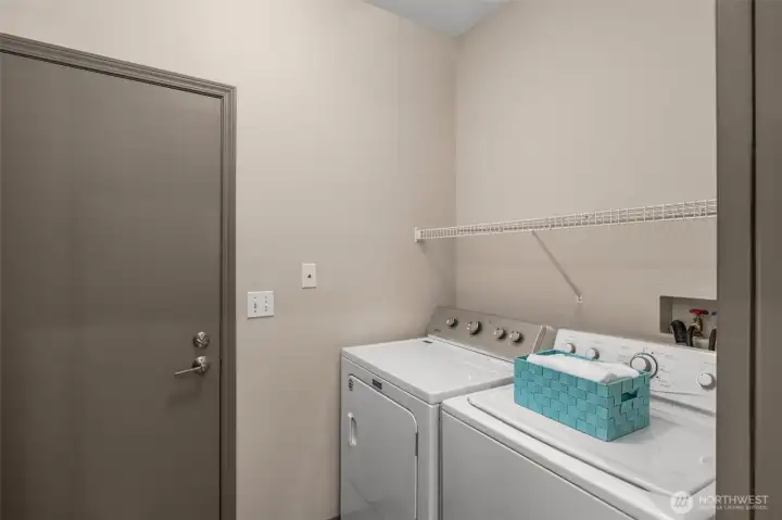 Full laundry room with access to attached garage