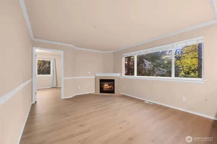 Living room with new LVP flooring throughout first floor.