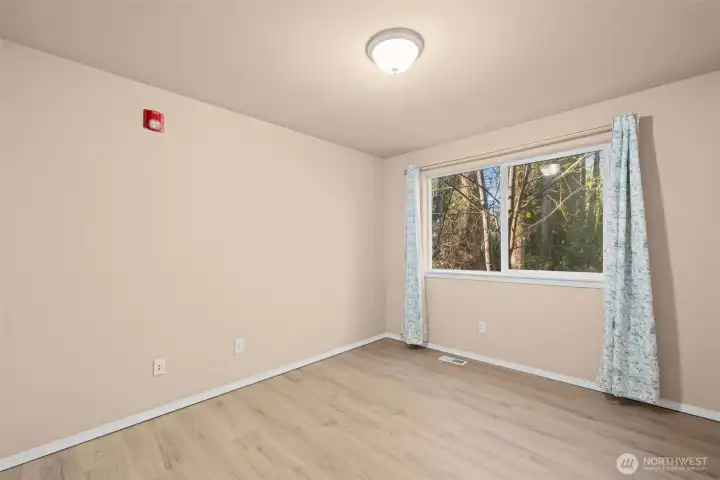 Bedroom on first floor with LVP flooring.
