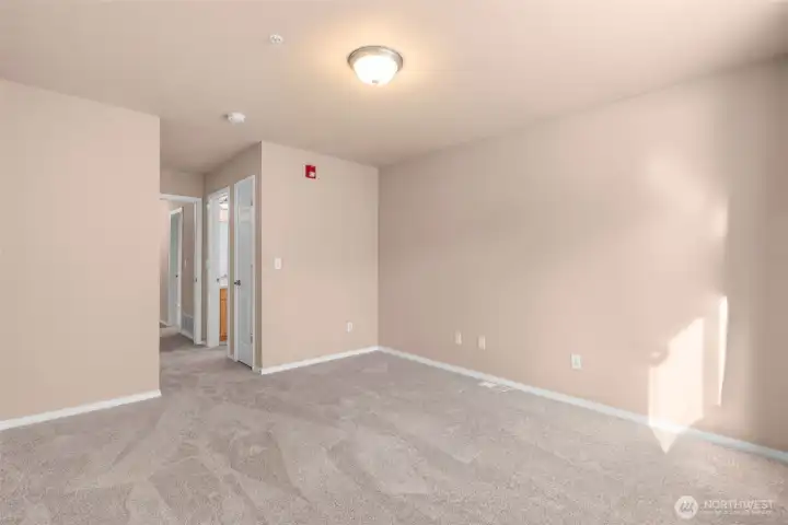 Primary bedroom with ensuite bathroom and walk-in closet.