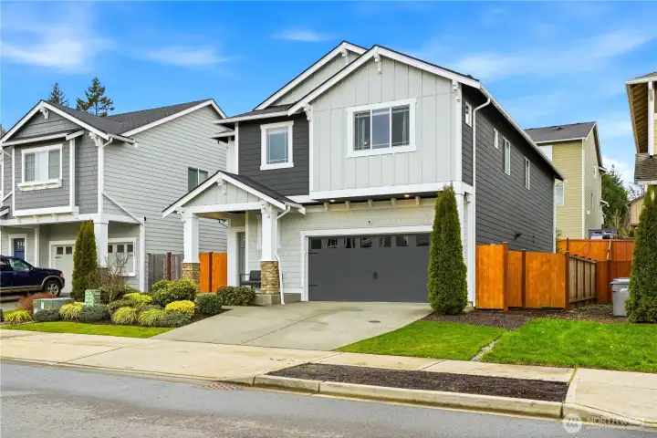 Front exterior of this Covington WA home for sale featuring modern architecture, clean landscaping, and strong curb appeal in a desirable community near parks, trails, and shopping in Covington Washington real estate.