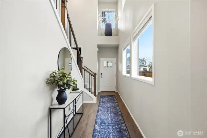 View of the entryway  and usable indoor space in  this modern Covington WA home for sale built in 2020.