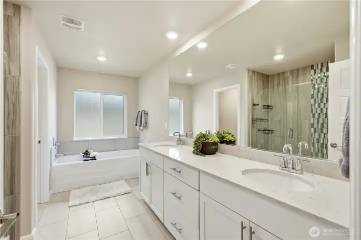 Private primary bedroom with large windows and relaxing atmosphere in this Covington Washington real estate listing.