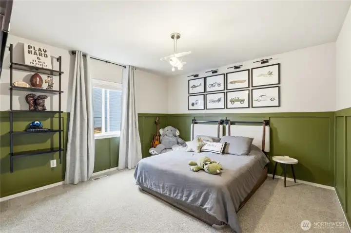 Secondary bedroom with large window and closet space in this Covington Washington home for sale located in the Kent School District.