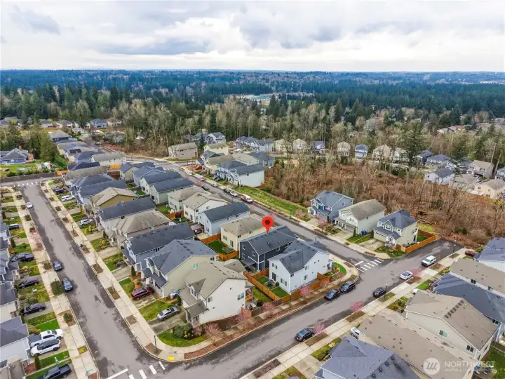Wide aerial view of the surrounding neighborhood showcasing the location of this Covington WA home for sale within a well maintained community close to parks, trails, shopping, and commuter routes.