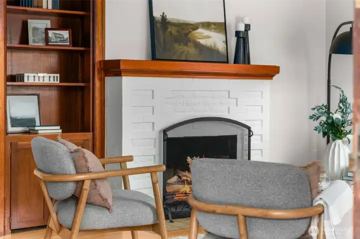 Built ins and a fireplace anchor the living room.