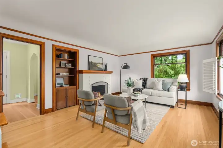 Original hardwood floors, coved ceilings and custom window treatements.