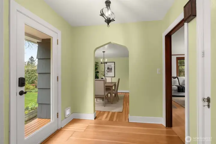 Rear foyer becomes a "middle space" as guests spill into the back yard or drift between the kitchen to the dining room.