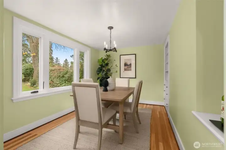 Lovely views of the back yard with upgraded windows to let in the breeze.