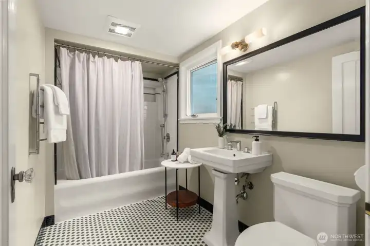 Lovely soaking tub with original 1928 tiling.