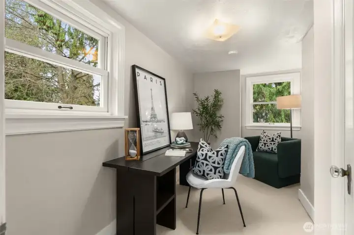 Petite third bedroom. Can fit a twin bed and has a closet (behind the door). Previously used as an office.  Has lovely views of the rear yard.