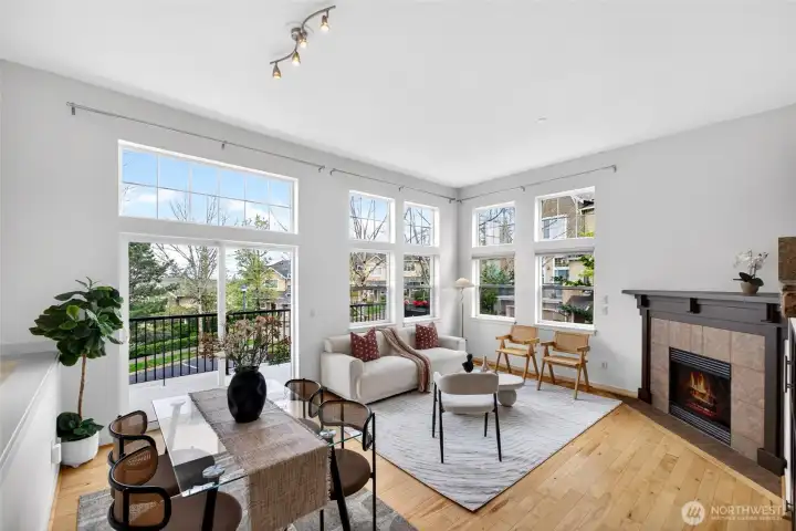 Bright, corner-position living space with an abundance of windows that fill the room with natural light throughout the day. The open layout connects seamlessly to the dining area and private balcony, creating an easy indoor-outdoor flow.