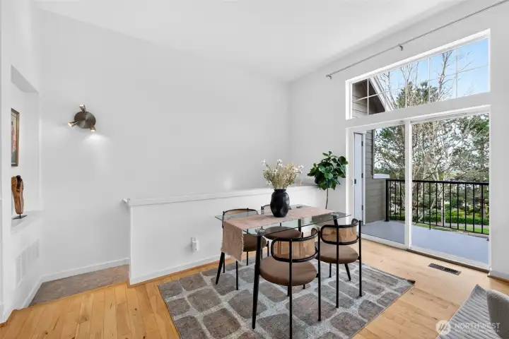 Surrounded by an abundance of windows, the dining area is filled with natural light throughout the day. The corner positioning of the home truly shines here, creating an open, airy atmosphere that enhances both daily living and entertaining. Easy access to the back patio allows inside/outside entertaining.