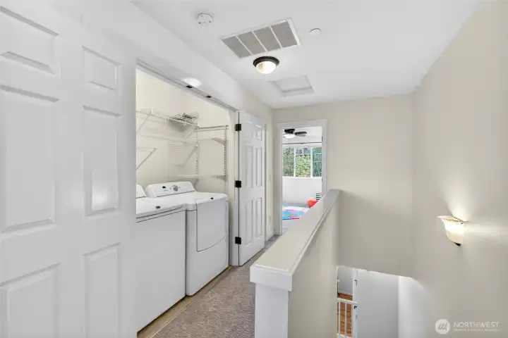 Conveniently located on the upper level, the laundry area keeps daily routines efficient and accessible. Integrated shelving adds extra functionality without taking away from usable space.