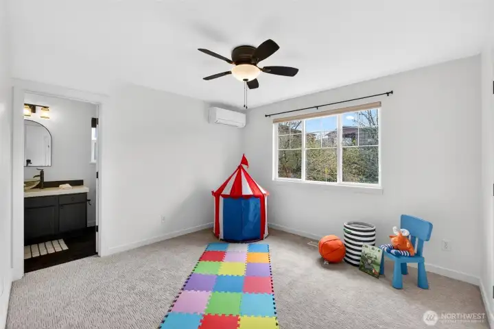 Bright and versatile, this bedroom offers flexibility for a variety of needs, whether used as a bedroom, office, or creative space. Large windows bring in natural light while maintaining a comfortable sense of privacy.