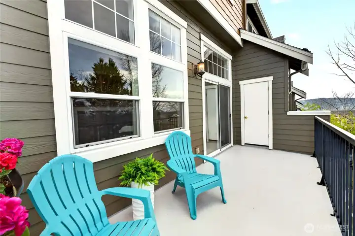 The rear deck offers a private outdoor extension of the living space, ideal for relaxing or casual gatherings. A dedicated, locked storage room is conveniently located just off the deck, adding practical utility without sacrificing usable space.