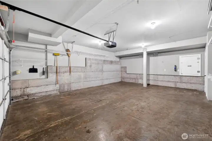 A full two-car garage provides ample room for parking, storage, and additional workspace. The extra depth and wall storage options make it far more functional than typical townhome garages.