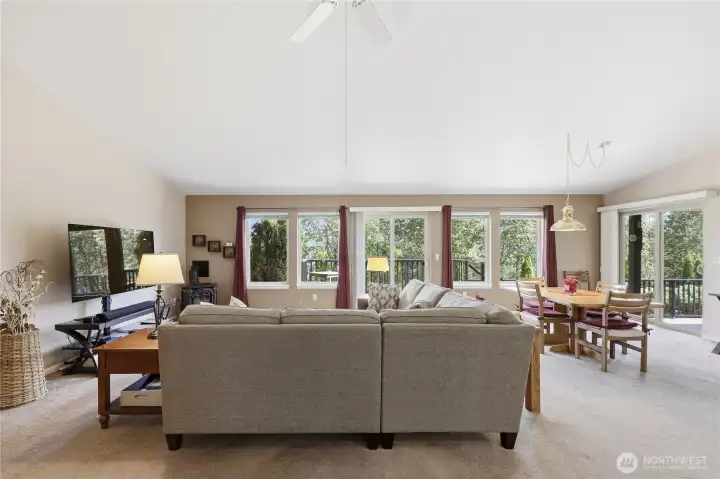 The home has an open living/dining room design, anchored by a propane fireplace in the corner.