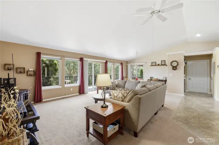 Lots of windows and vaulted ceiling give the room an expansive feel.