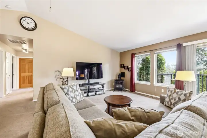 Walking back through the living room towards the bedrooms.