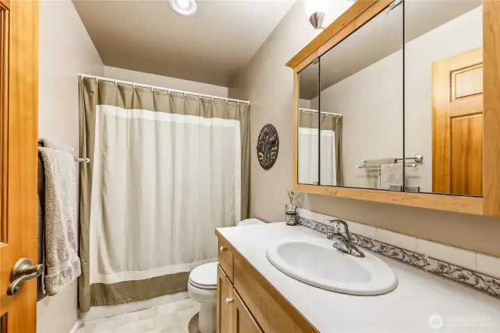 Hall bath with bath/shower combination.