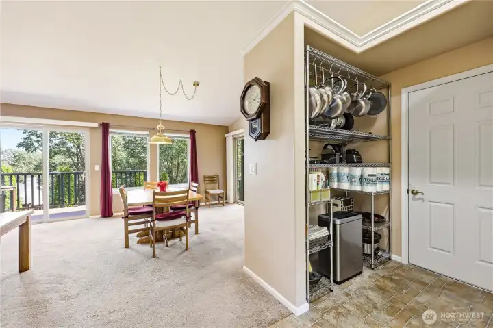 Walking back through the home towards the door to the attached garage.