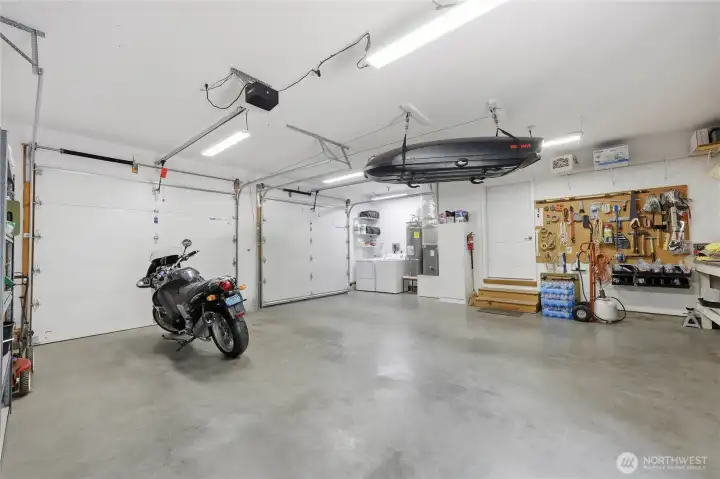 The spacious garage houses two cars plus lots of room for workbenches and storage.