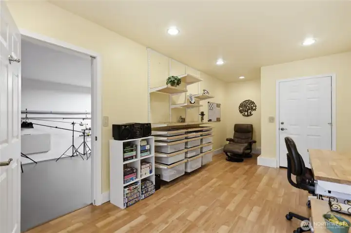 The studio has a front door from the driveway, perfect for a home business.  The door on the left leads to the 3rd garage bay (currently used as a photography room).