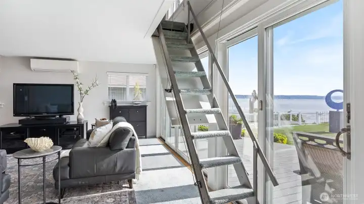 Pull-down staircase/ladder is used to access the loft bedroom