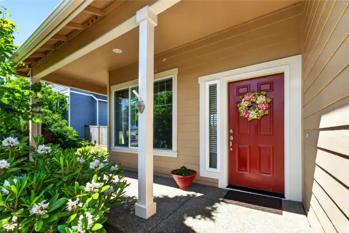 This charming covered front porch welcomes you.