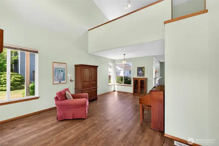 This is your view as you walk in the front door. Note the vaulted ceiling and new laminate hardwood flooring.