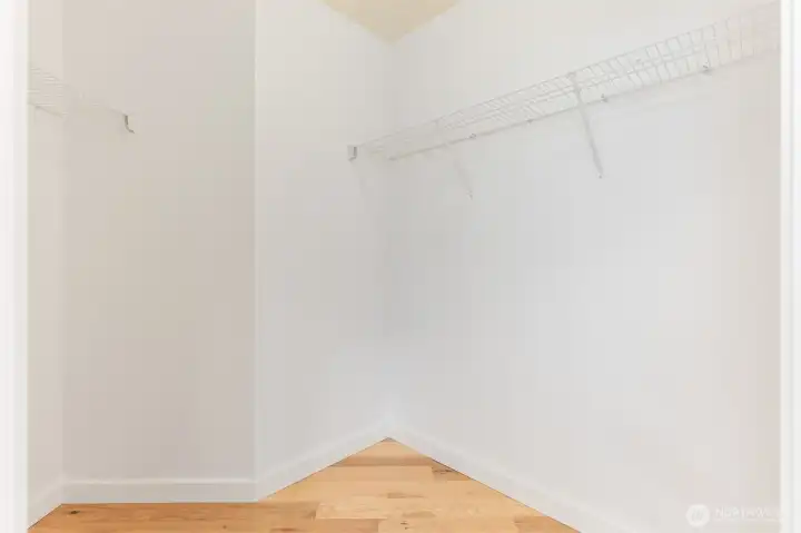 Primary bedroom walk-in closet Primary bedroom walk-in closet