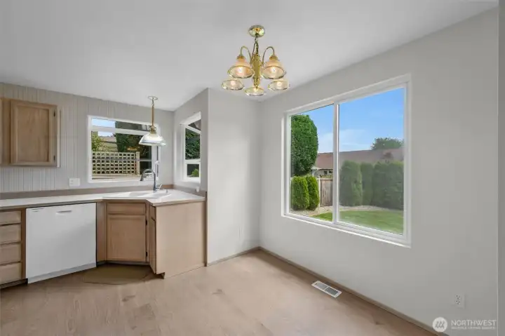 View of the backyard from the kitchen with breakfast nook.