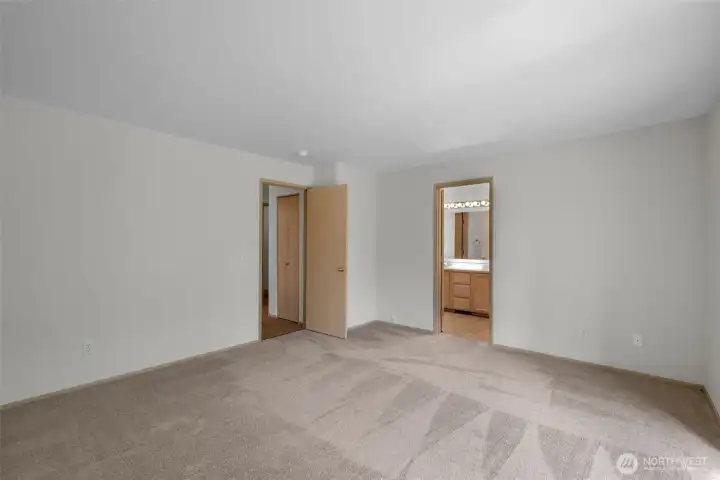 Primary bedroom with access to en-suite bathroom.