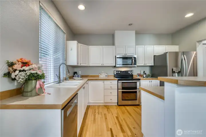 itchen showing the stainless steel appliances including dishwasher, garbage disposal, double oven, microwave, and refridgerator with water dispenser/ice maker. itchen showing the stainless steel appliances including dishwasher, garbage disposal, double oven, microwave, and refridgerator with water dispenser/ice maker.