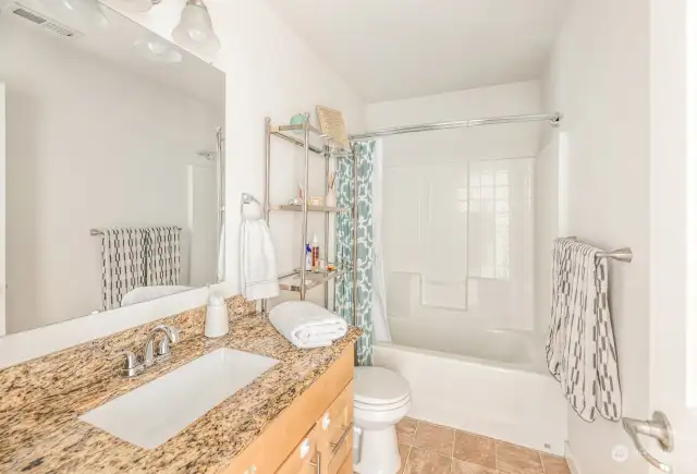 Full bath with granite counters in upstairs hallway