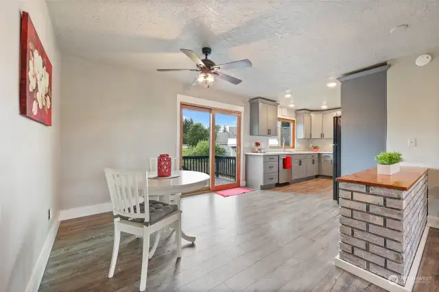 Bountiful space in the darling kitchen and dining area! Slider brings in light and provides easy access to the deck and yard, as well as views of the yard and field in back.