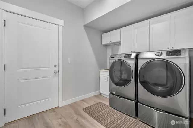 The door from the laundry room leads to the garage.  Washer and Dryer stay with home.