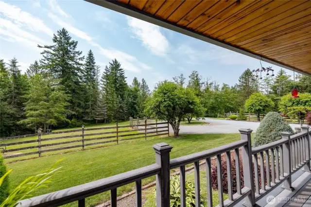 Lovely view from your covered front porch with pine soffits.