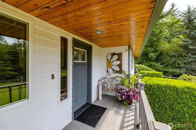 Gorgeous pine soffits and overhead lighting in the covered front patio.  There is also an electrical outlet with switch in the garage for holiday lights!