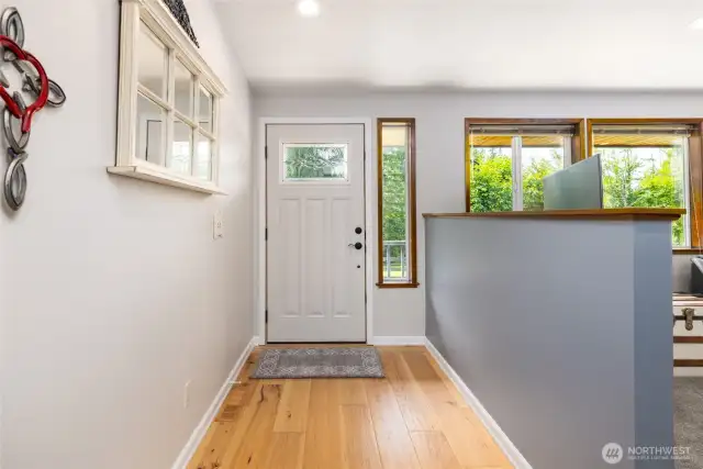 Entryway with new fiberglass door that features 4 automatic deadbolt security. Both Exterior Doors have this feature and our solid fiberglass.
