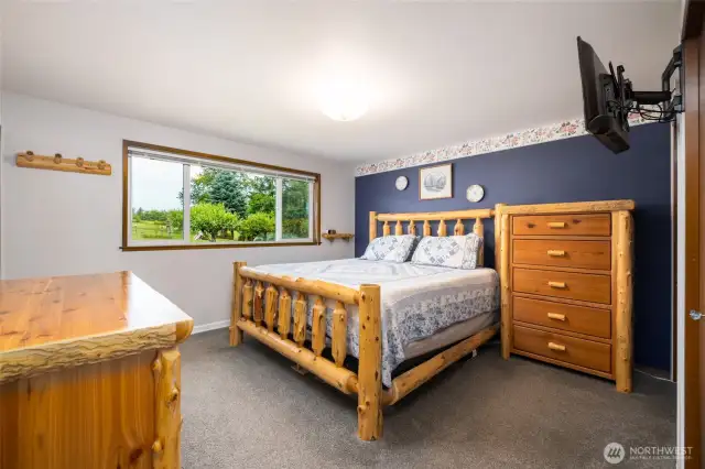 Primary bedroom with ensuite and gorgeous views to back acreage.