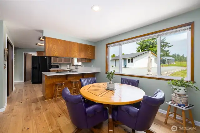Kitchen with so much storage, quartz countertops, two pantries, breakfast bar and open to eating area so you can converse with family and guest while cooking up a great meal.