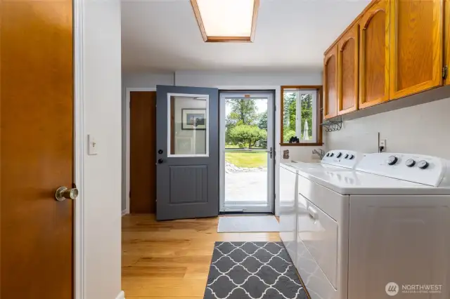 Utility Room with storage, deep sink, cold closet and notice the binoculars for bird watching!