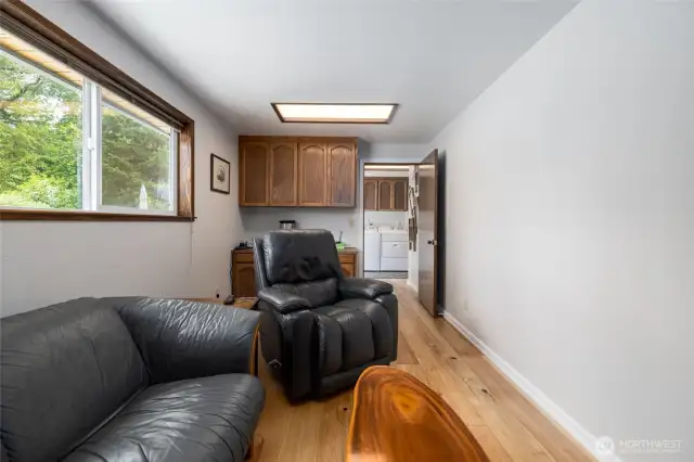Office with built-in desk and large window to enjoy view of the back yard.