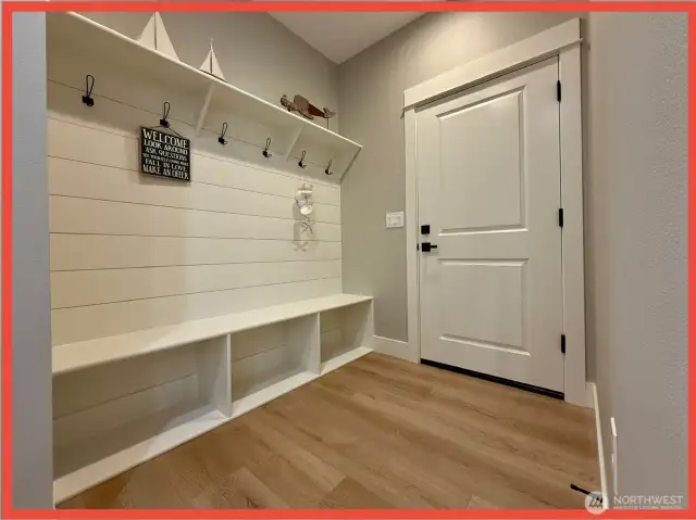 Mudroom w/built-in coat rack/bench.