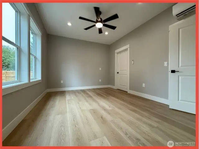 Private primary en-suite with spa-like bath including a custom soaking tub, walk in shower & water closet.