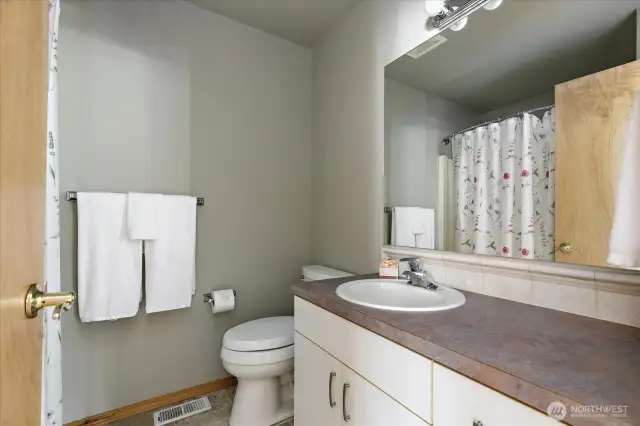 Guest bath conveniently located close to living area.