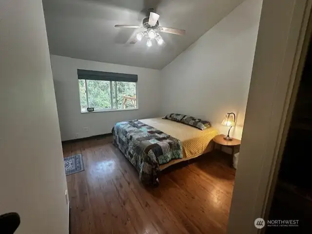 Primary is HUGE with Large windows looking over property with on suite